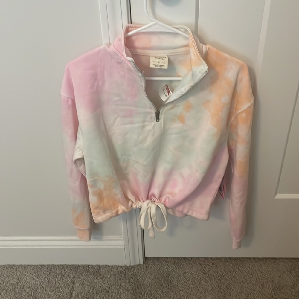 Multi colored cropped quarter zip with a tie